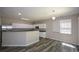 Contemporary kitchen with white cabinets, stainless steel appliances, and an island at 5660 Sable Bay Pt, Atlanta, GA 30349