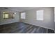 Bright Living room featuring wood-look floors and bright neutral walls at 5660 Sable Bay Pt, Atlanta, GA 30349