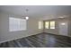 Bright and airy living room with wood-look flooring and recessed lighting at 5660 Sable Bay Pt, Atlanta, GA 30349