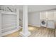 Basement features a bookshelf, support column, and a laundry area with a washer and dryer at 638 Cooledge Ne Ave, Atlanta, GA 30306