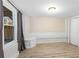 Neutral basement with white painted brick, painted walls, and wide-plank vinyl flooring at 638 Cooledge Ne Ave, Atlanta, GA 30306
