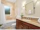 Bathroom featuring a shower-tub combo, granite countertop, and neutral tones in a well-lit space at 638 Cooledge Ne Ave, Atlanta, GA 30306