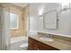 Elegant bathroom featuring granite countertop, marble tile surround, and brushed nickel fixtures at 638 Cooledge Ne Ave, Atlanta, GA 30306