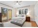 Bright bedroom with large windows, hardwood floors, and sliding door access to a private deck at 638 Cooledge Ne Ave, Atlanta, GA 30306