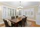 Dining room showcasing hard wood floors, neutral paint, and large windows with white shutters at 638 Cooledge Ne Ave, Atlanta, GA 30306