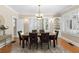 Well-lit dining room with hardwood floors, and large windows with white shutters at 638 Cooledge Ne Ave, Atlanta, GA 30306