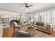 Bright living room featuring hardwood floors, neutral paint, fireplace, and open dining at 638 Cooledge Ne Ave, Atlanta, GA 30306
