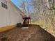 Backyard with walkout deck and stairs visible from the rear of the home at 120 Grove Ln, Temple, GA 30179