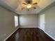 Spacious bedroom features a trey ceiling, ceiling fan, wood-look floors, and lots of natural light at 120 Grove Ln, Temple, GA 30179
