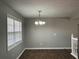 Bright dining area with chandelier, tile floors and natural light at 120 Grove Ln, Temple, GA 30179