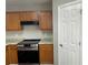 Updated kitchen featuring modern appliances, wood cabinets and granite countertops at 120 Grove Ln, Temple, GA 30179