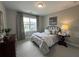 Comfortable bedroom with natural light, and neutral decor at 2702 Wollerton St # 2702, Cumming, GA 30040