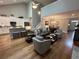 Spacious open-concept living room and kitchen with hardwood floors and neutral decor at 2702 Wollerton St # 2702, Cumming, GA 30040