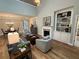 Open-concept living room with fireplace, hardwood floors, and ample natural light at 2702 Wollerton St # 2702, Cumming, GA 30040