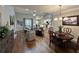 Bright living room with hardwood floors and fireplace, open to the dining area and kitchen at 2702 Wollerton St # 2702, Cumming, GA 30040