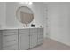 Modern bathroom featuring a vanity with gray cabinets, a white countertop, and brushed nickel hardware at 345 Sugarview Rd, Sugar Hill, GA 30518