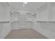 Spacious walk-in closet with ample shelving and storage space is well-organized providing the perfect wardrobe solution at 345 Sugarview Rd, Sugar Hill, GA 30518