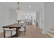 Elegant dining area leading into a modern kitchen at 345 Sugarview Rd, Sugar Hill, GA 30518