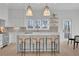 Bright kitchen with a breakfast bar and open view at 345 Sugarview Rd, Sugar Hill, GA 30518
