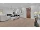 Bright living room with fireplace, modern lighting, and decor is the perfect place to relax and entertain guests at 345 Sugarview Rd, Sugar Hill, GA 30518