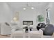 Cozy living room with modern fireplace, elegant lighting, and stylish decor, offers a comfortable living space at 345 Sugarview Rd, Sugar Hill, GA 30518