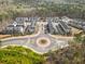 An aerial view showcases the neighborhood layout and surrounding green space at 2020 Rivermont Way, Roswell, GA 30076