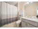 The bathroom features updated fixtures, a combination tub and shower at 2020 Rivermont Way, Roswell, GA 30076