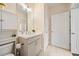 Well-lit bathroom featuring a neutral color scheme, built-in storage, and tiled flooring at 2020 Rivermont Way, Roswell, GA 30076