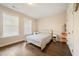 A well-lit bedroom features hardwood floors and a cozy atmosphere at 2020 Rivermont Way, Roswell, GA 30076