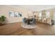 The staged dining room features modern decor, hardwood floors, and an open layout to the kitchen at 2020 Rivermont Way, Roswell, GA 30076
