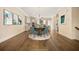 The staged dining area showcases modern pendant lighting, hardwood floors, and an open layout to the kitchen at 2020 Rivermont Way, Roswell, GA 30076