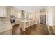 Spacious kitchen featuring stainless appliances, a center island with seating, and hardwood floors at 2020 Rivermont Way, Roswell, GA 30076