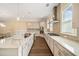 Modern kitchen featuring stainless steel appliances, expansive countertop space, and hardwood floors at 2020 Rivermont Way, Roswell, GA 30076