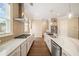 Modern kitchen featuring stainless steel appliances, mosaic backsplash, and marble countertops at 2020 Rivermont Way, Roswell, GA 30076