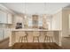 Bright kitchen featuring a center island with seating, modern appliances, and neutral color palette at 2020 Rivermont Way, Roswell, GA 30076