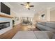 Spacious open-concept living room with fireplace, hardwood floors, and view to kitchen and dining at 2020 Rivermont Way, Roswell, GA 30076