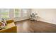 Bright office space with hardwood floors, desk, and comfortable yellow sofa at 2020 Rivermont Way, Roswell, GA 30076