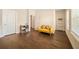 Bright office space with hardwood floors, desk, storage, and comfortable yellow sofa at 2020 Rivermont Way, Roswell, GA 30076