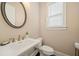 Elegant powder room with modern sink, faucet, and toilet at 2020 Rivermont Way, Roswell, GA 30076