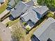 Aerial view of a well-maintained home with a private patio, landscaped yard, and a two-car garage at 429 Argonne Ter, Canton, GA 30115
