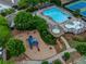 Aerial view showcasing the community pool, playground, and tennis courts surrounded by lush greenery at 429 Argonne Ter, Canton, GA 30115