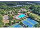 Aerial shot of community tennis and basketball courts by a beautiful lake at 429 Argonne Ter, Canton, GA 30115