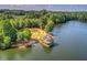Aerial view of a charming gazebo on a lakefront, surrounded by lush greenery and a peaceful setting at 429 Argonne Ter, Canton, GA 30115