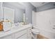 Full bathroom features tiled shower, a vanity with storage, and wood-look flooring at 429 Argonne Ter, Canton, GA 30115