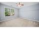 Bright bedroom offers ample natural light and neutral carpeting at 429 Argonne Ter, Canton, GA 30115