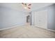 Inviting bedroom boasts neutral carpeting, double closets, and ample space at 429 Argonne Ter, Canton, GA 30115