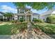 Inviting two-story home with a manicured lawn, lovely landscaping, and a welcoming yellow front door at 429 Argonne Ter, Canton, GA 30115