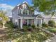 Charming two-story home with a manicured lawn and inviting front porch, featuring a yellow front door at 429 Argonne Ter, Canton, GA 30115