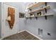 Functional laundry room includes built-in shelving, storage, and washer/dryer hookups at 429 Argonne Ter, Canton, GA 30115