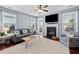 Inviting living room with natural light, fireplace, and comfortable seating at 429 Argonne Ter, Canton, GA 30115